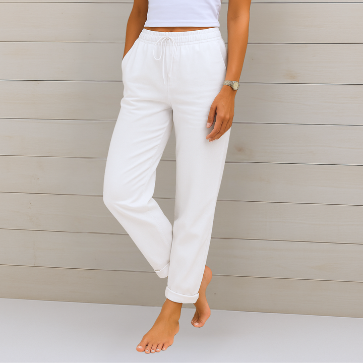 Female model wearing breathable elastic waist trousers against a plain background.