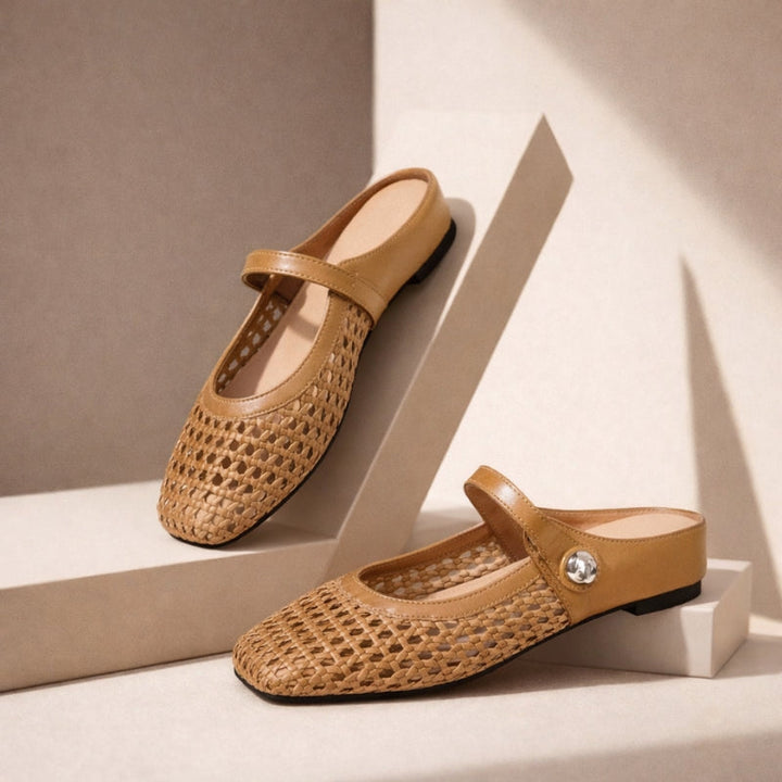 Mule shoes against a plain background.