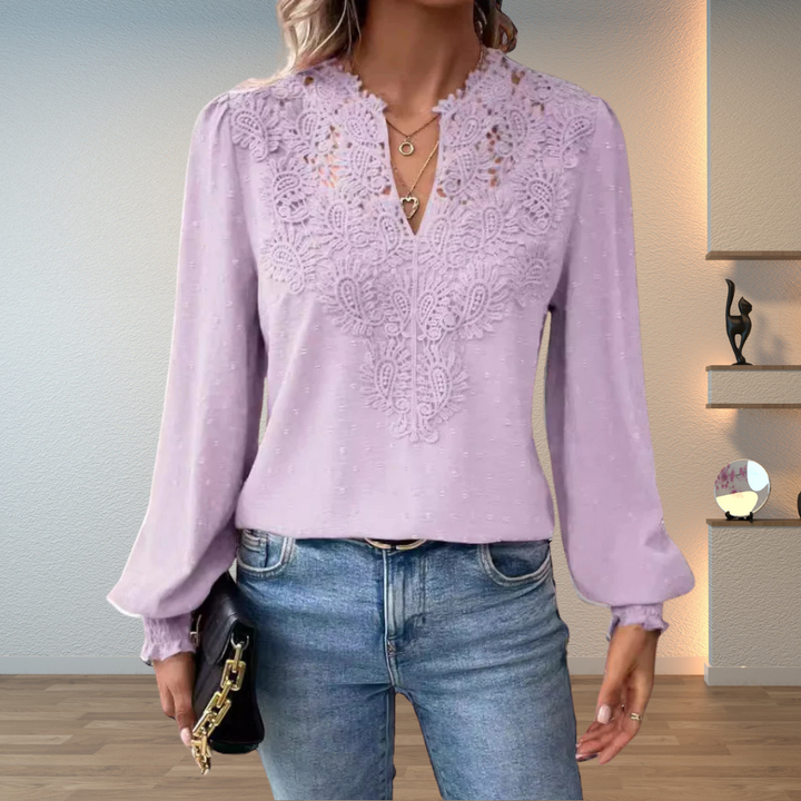 Woman wearing a classic blouse designed for everyday wear.