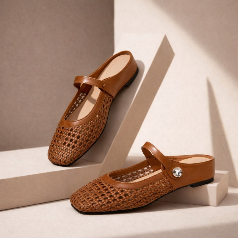 Woven slip-on flats on a plain background.