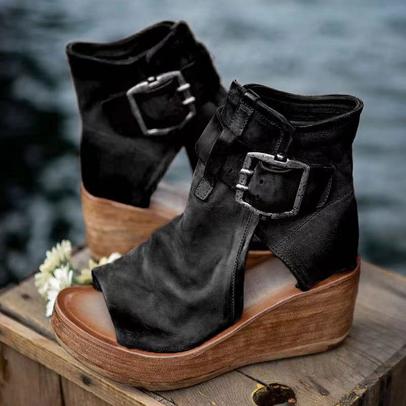 Female model showcasing casual boho sandals on a plain background.