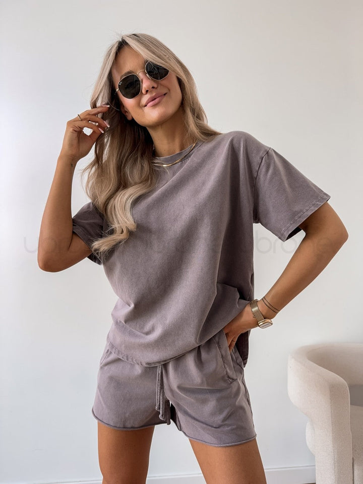 Female model in a coordinated striped outfit designed for casual daily wear.
