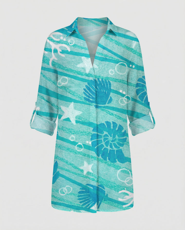 Loose-fit blouse with button placket and sea print.