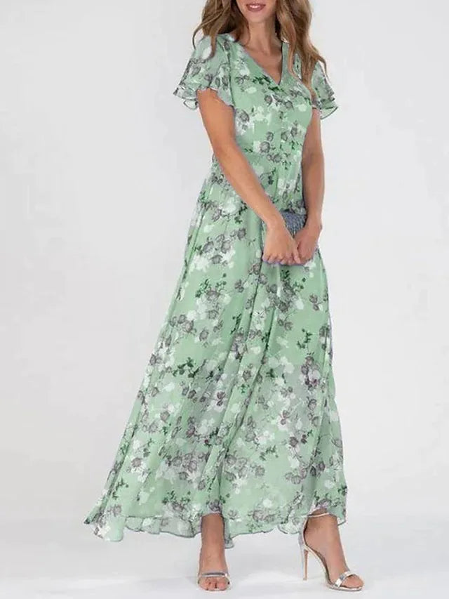 Woman wearing an elegant midi dress on a plain background.