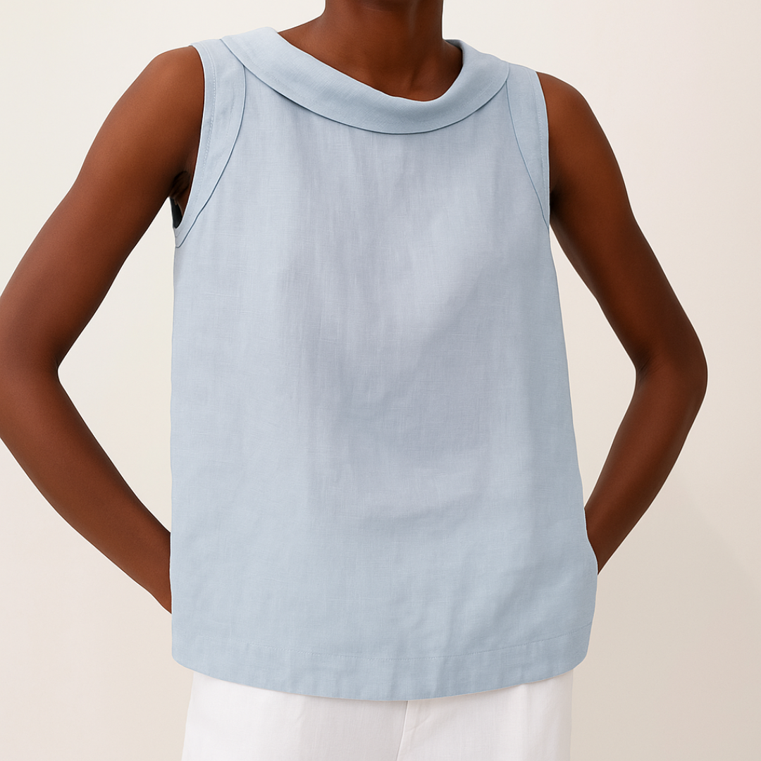 
Female model showcasing a sleeveless blouse with a modern rolled collar detail.