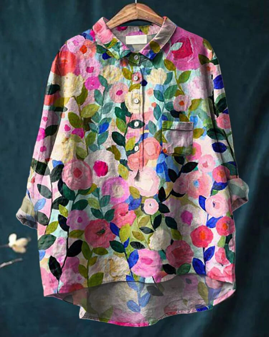 A floral print blouse with a flowing silhouette against a plain background.