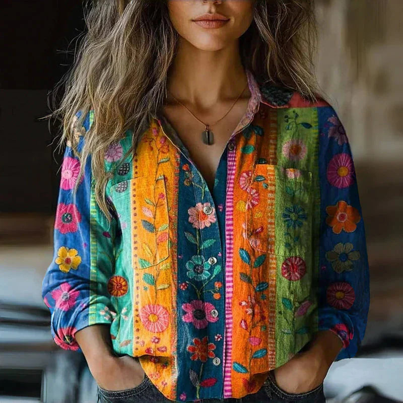  Woman modelling a casual bohemian-inspired blouse against a plain background.
