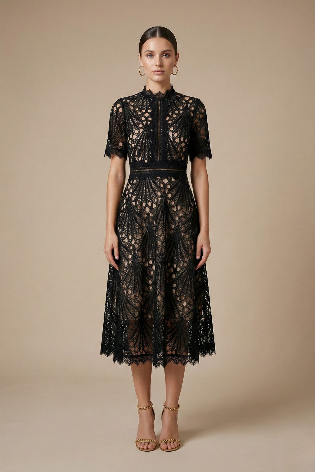 Female wearing a geometric cutwork midi dress with scalloped sleeves against a plain background.