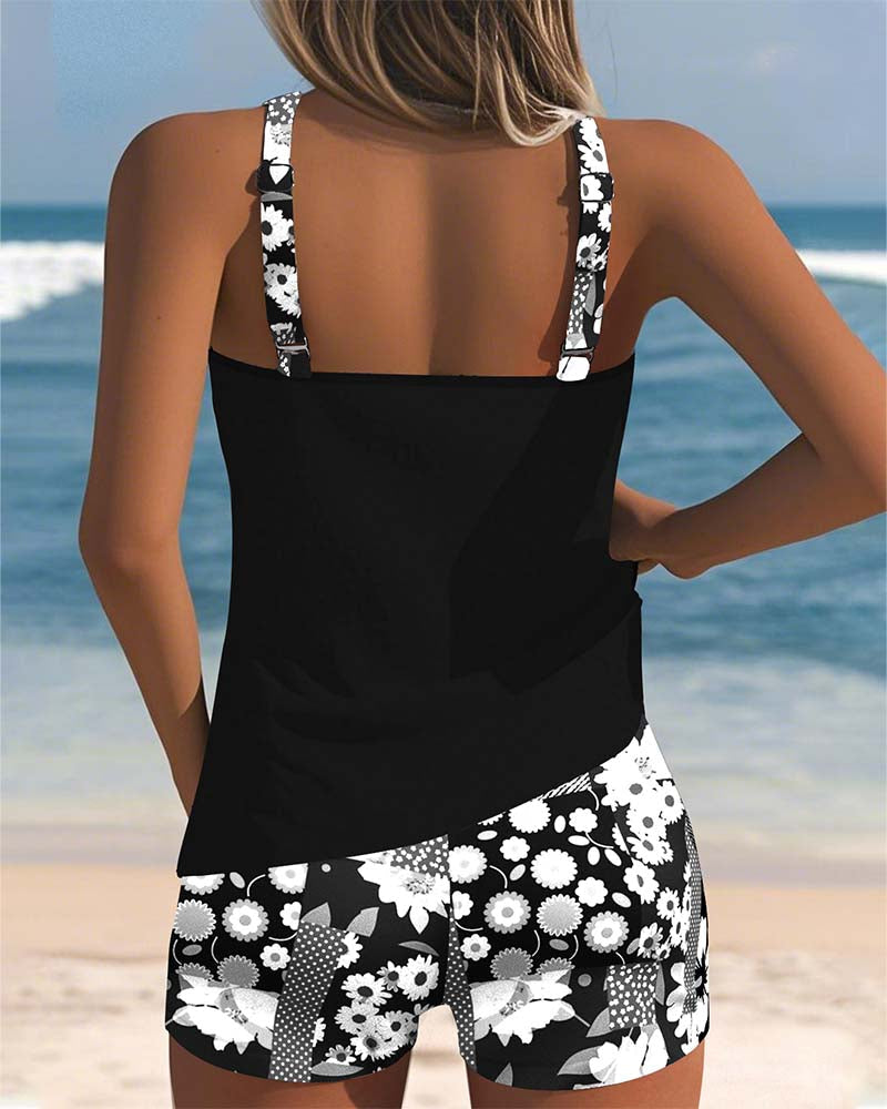 Female model wearing a covered two-piece swimsuit with floral shorts, back view