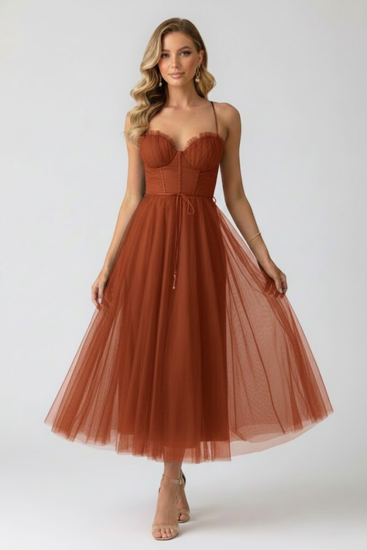 Female wearing a fitted bodice midi dress on a plain background.