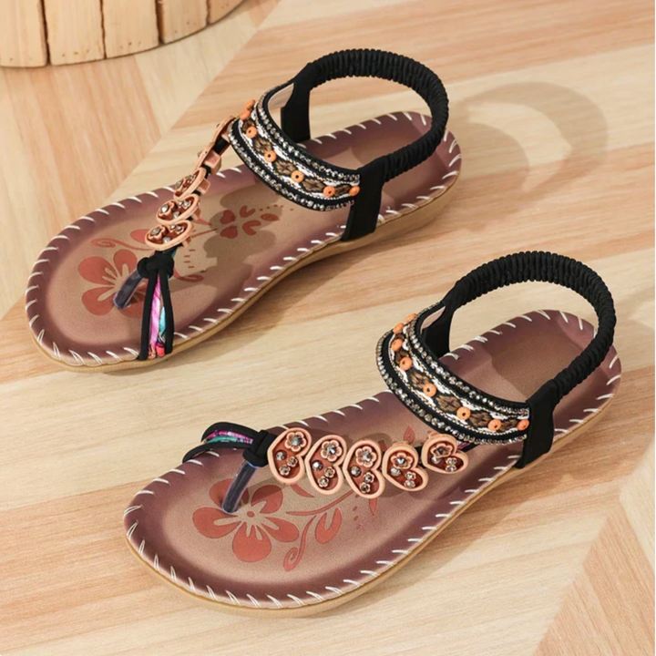 Open-toe sandals with detailed boho styling.