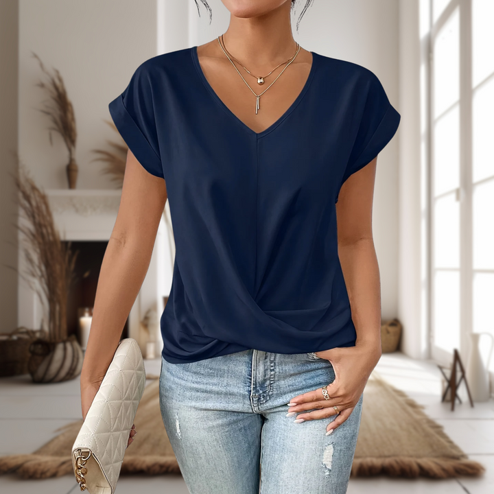  Woman modelling a short sleeve T-shirt with a flattering neckline.