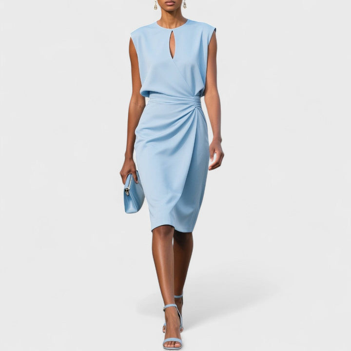 Female wearing an elegant evening dress with a flattering silhouette on a plain background.