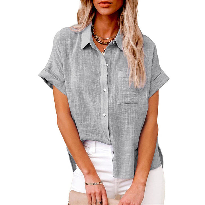  Female modelling a casual striped top on a plain background.