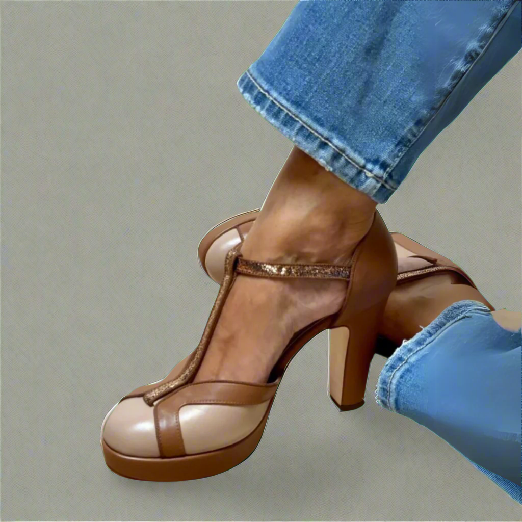 Woman wearing elegant heeled sandals on a plain background.