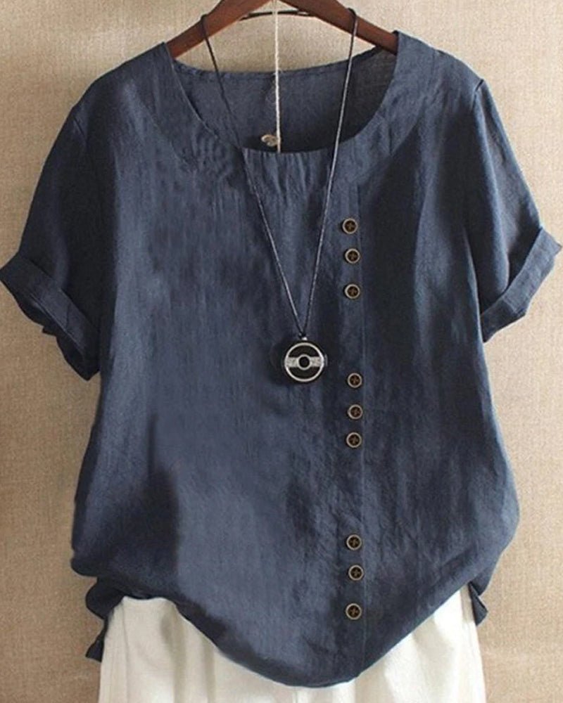  Female wearing a casual button front top with a crew neckline.