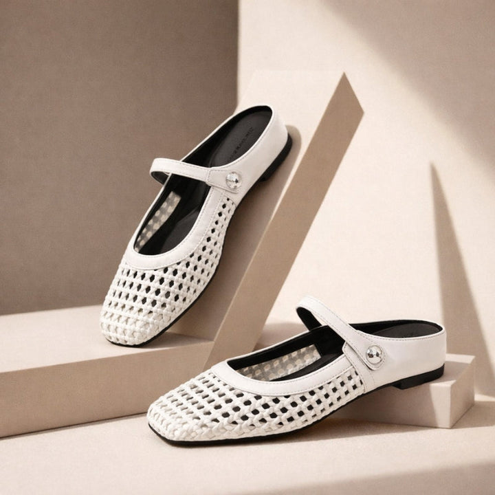 Slip-on Mary Jane mules on a plain background.