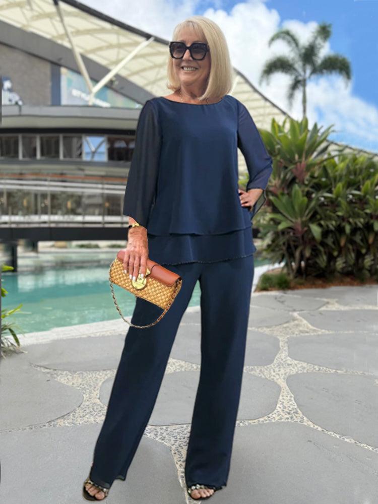 Woman modeling a relaxed two piece pants outfit on a vacation background.