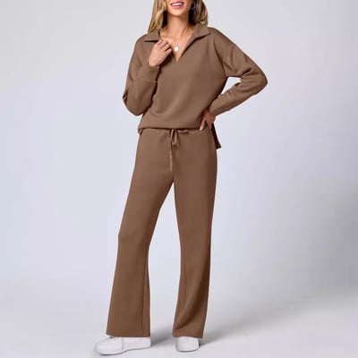 Woman modelling a fitted long-sleeved top with coordinating leggings.