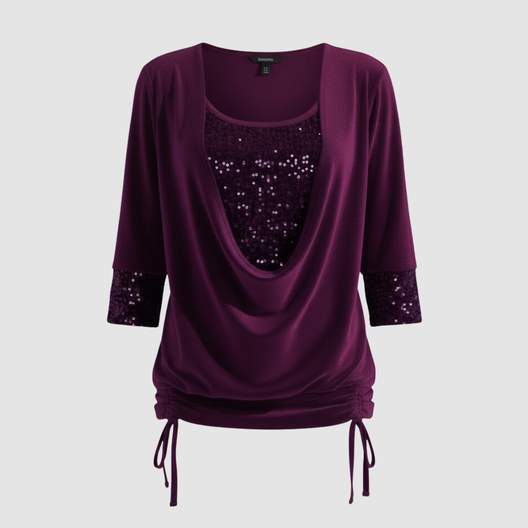 Relaxed long-sleeved blouse with soft shimmer detail.