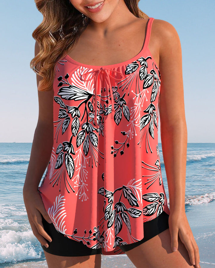 Female model wearing a printed tankini set with high-waist shorts