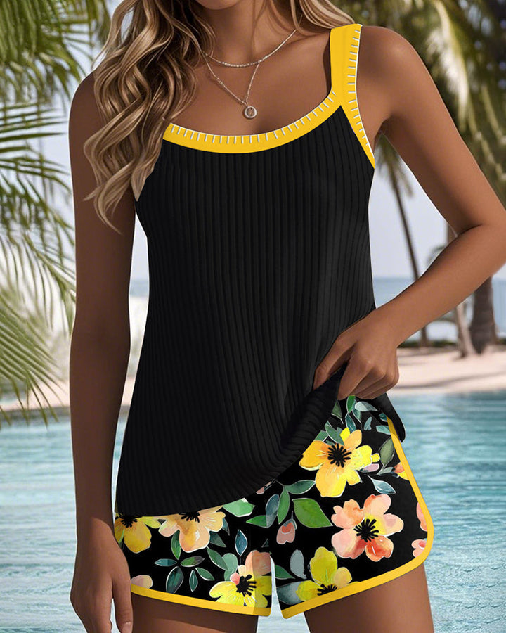 Female model showcasing a classic two-piece swimsuit with balanced coverage on a plain background.
