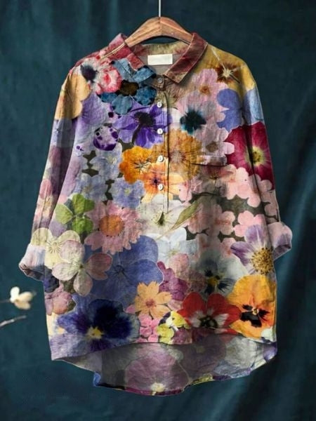 A flowing floral blouse against a plain background.