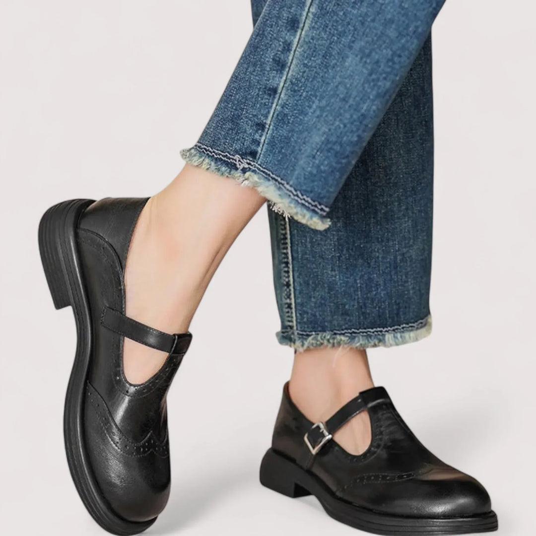 Casual Mary Jane flats on a plain background.