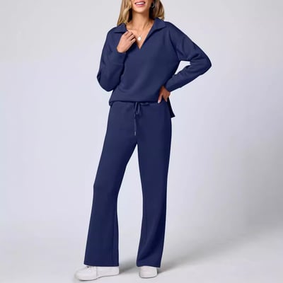 Female wearing a modern matching set with side slit long-sleeved top.