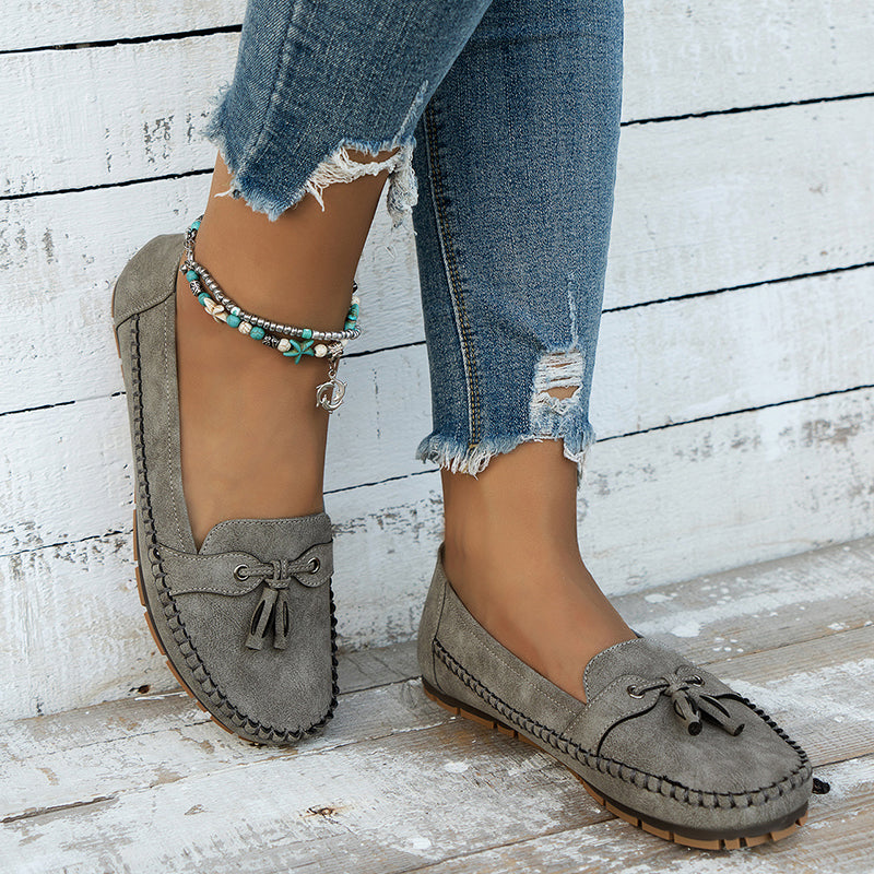 Stylish women’s flat loafers for everyday wear on a plain background.