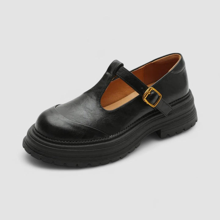 Mary Jane walking shoes on a plain background.