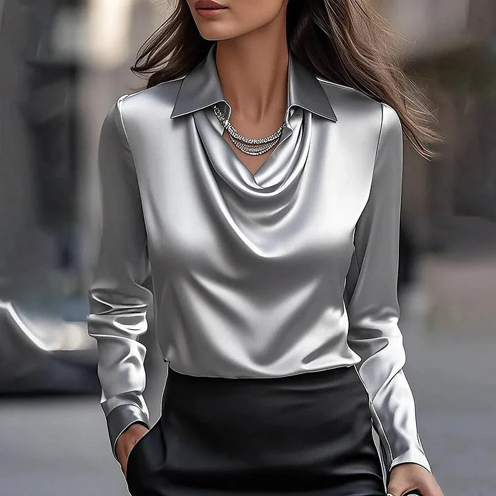  Woman in an elegant V-neck top with a graceful drape.
