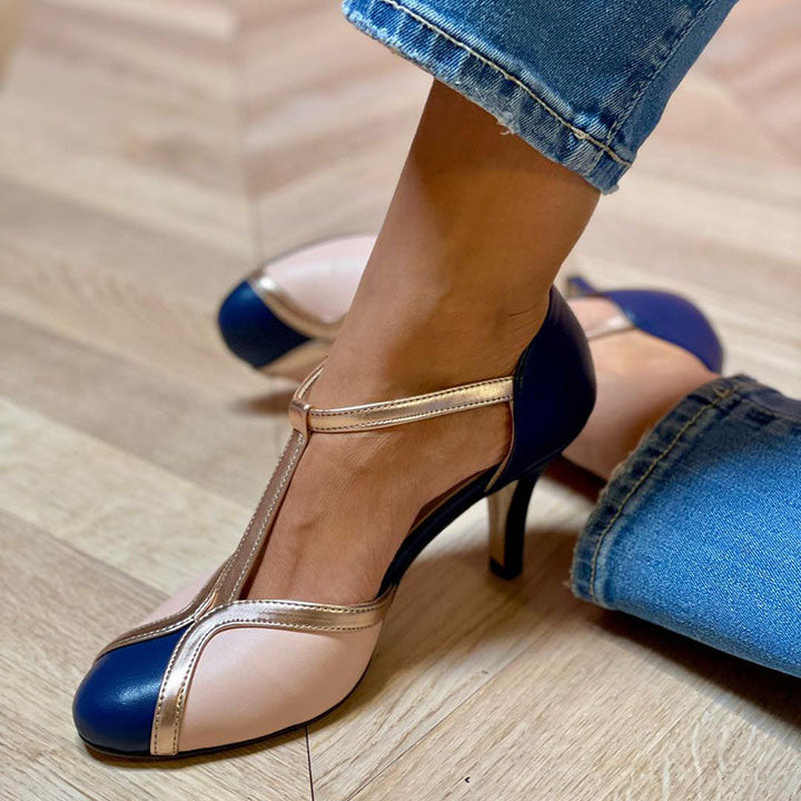 Colourful T-strap pumps on a plain background.