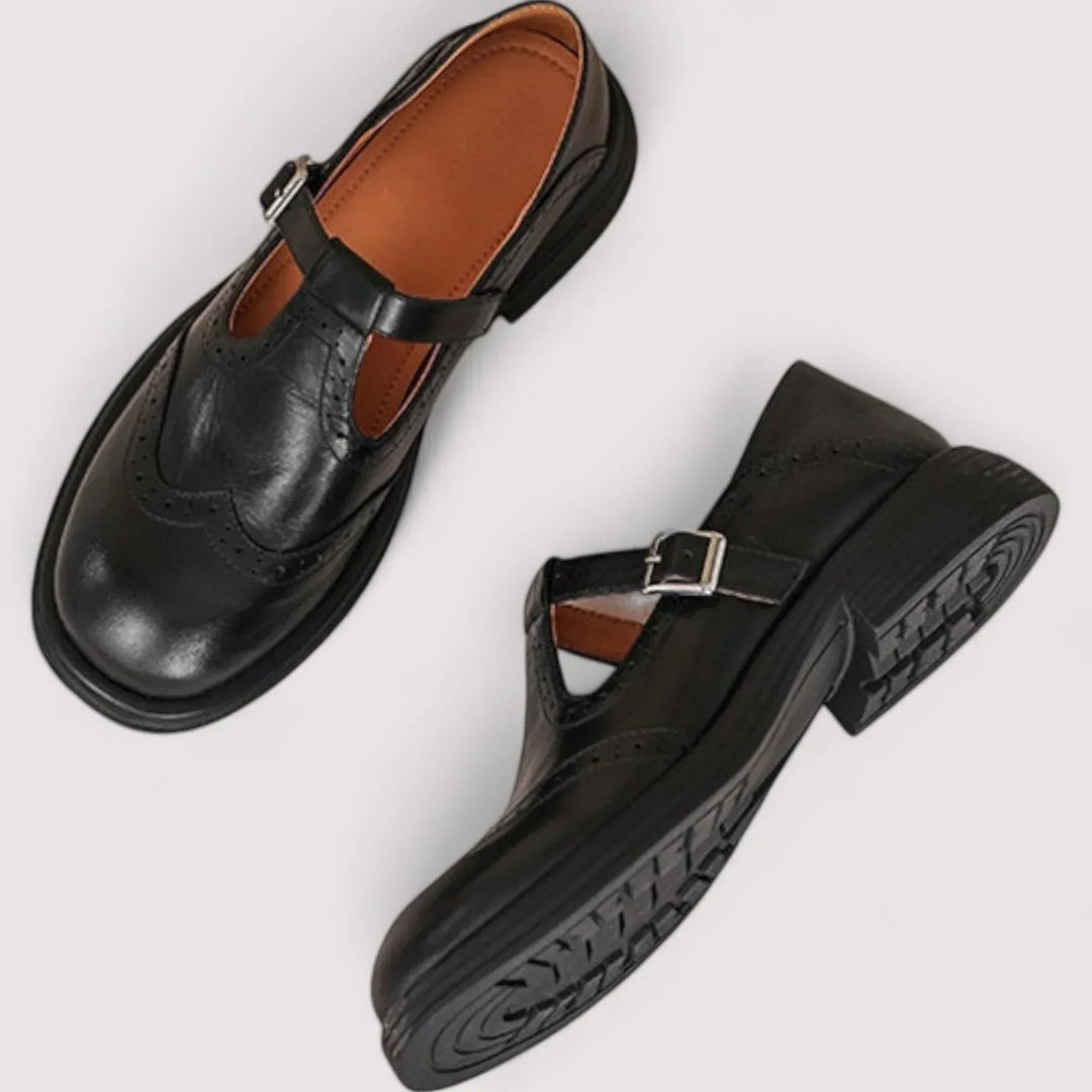 Mary Jane shoes on a plain background.