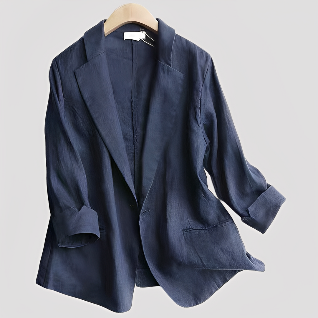  Female model in a smart-casual blazer with a contemporary silhouette and 3/4 sleeves.