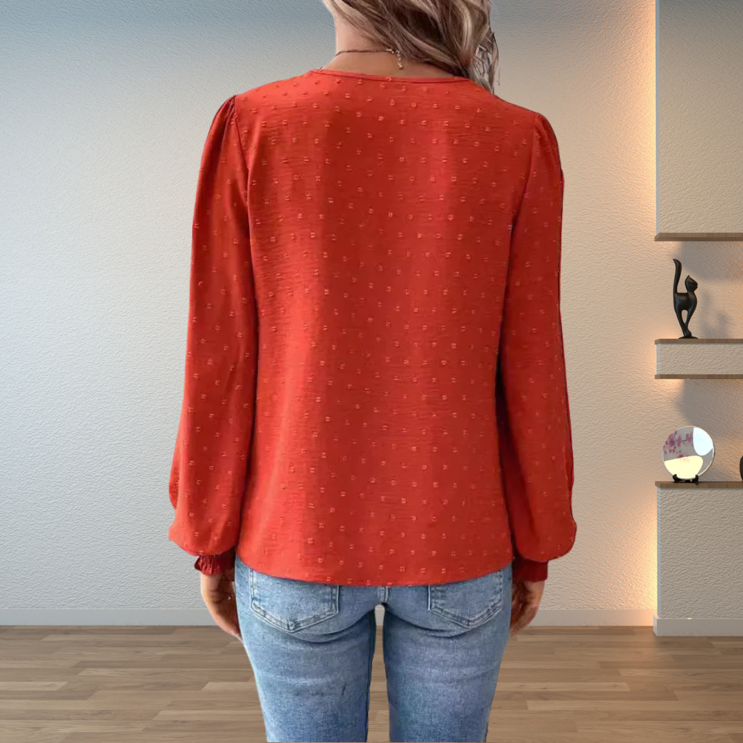  Female modelling a breathable blouse with an elegant everyday design. 