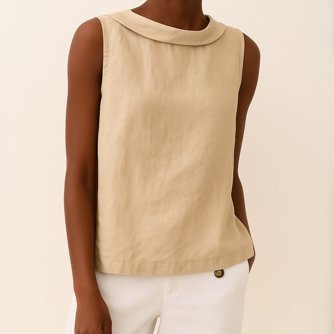  Female model in a sleeveless casual top featuring a stylish rolled neckline.