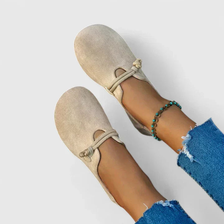 Female model wearing everyday loafers in a clean studio setting.