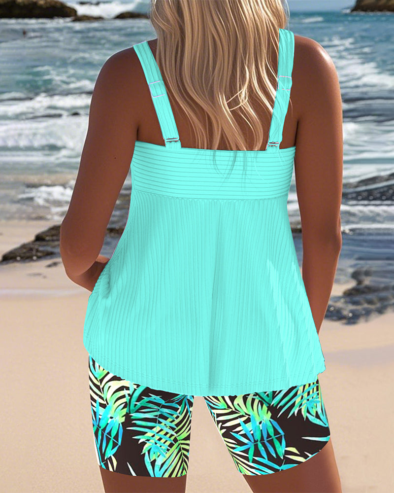 Woman in a high-waist printed swim set shown on a plain background.