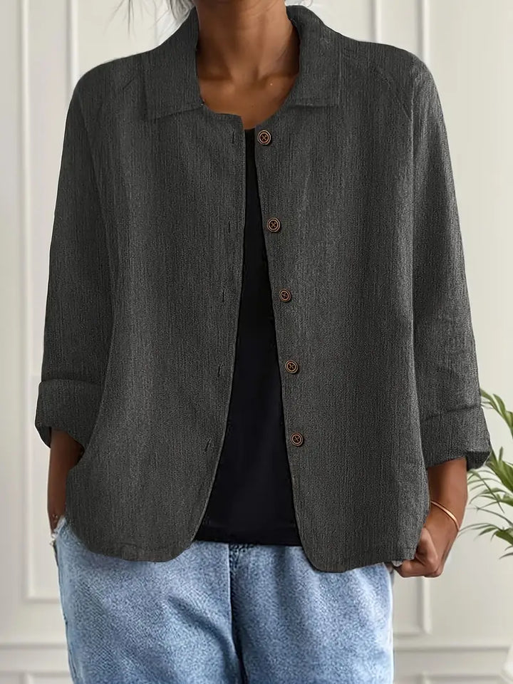 Woman wearing a long sleeve top with a clean and simple design.