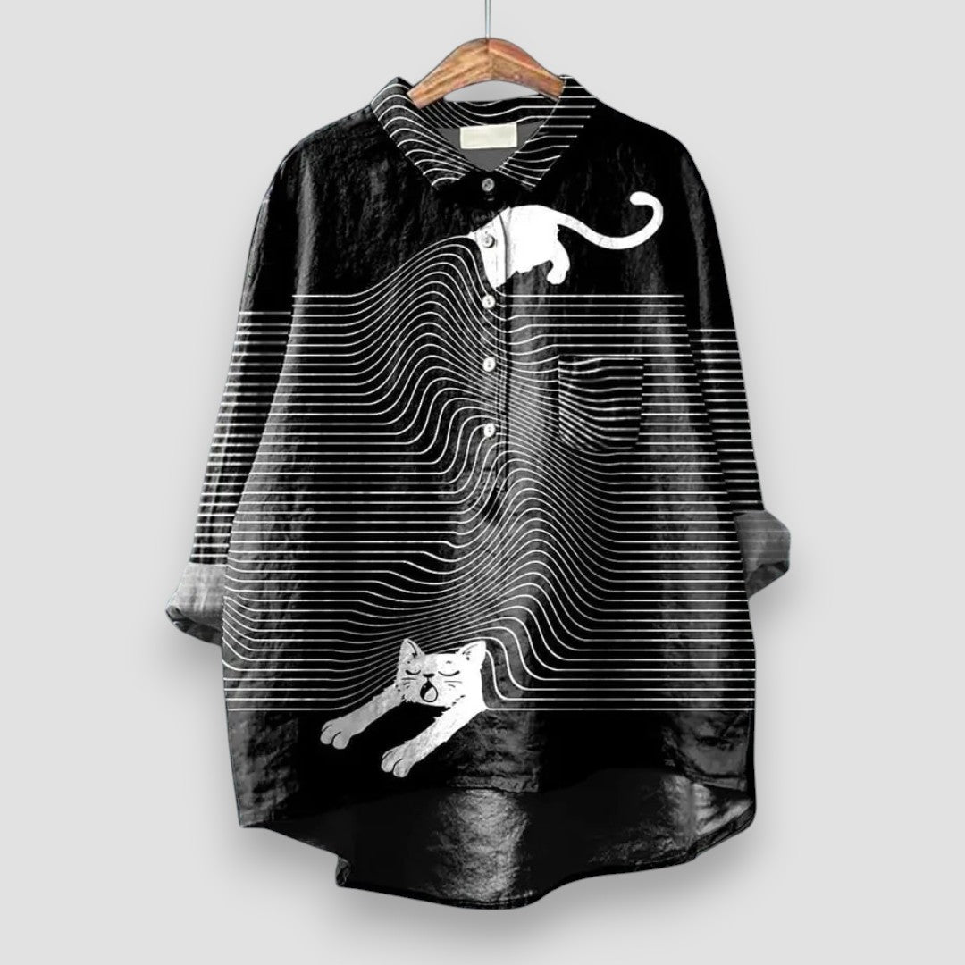A long sleeve dog print shirt against a plain background.