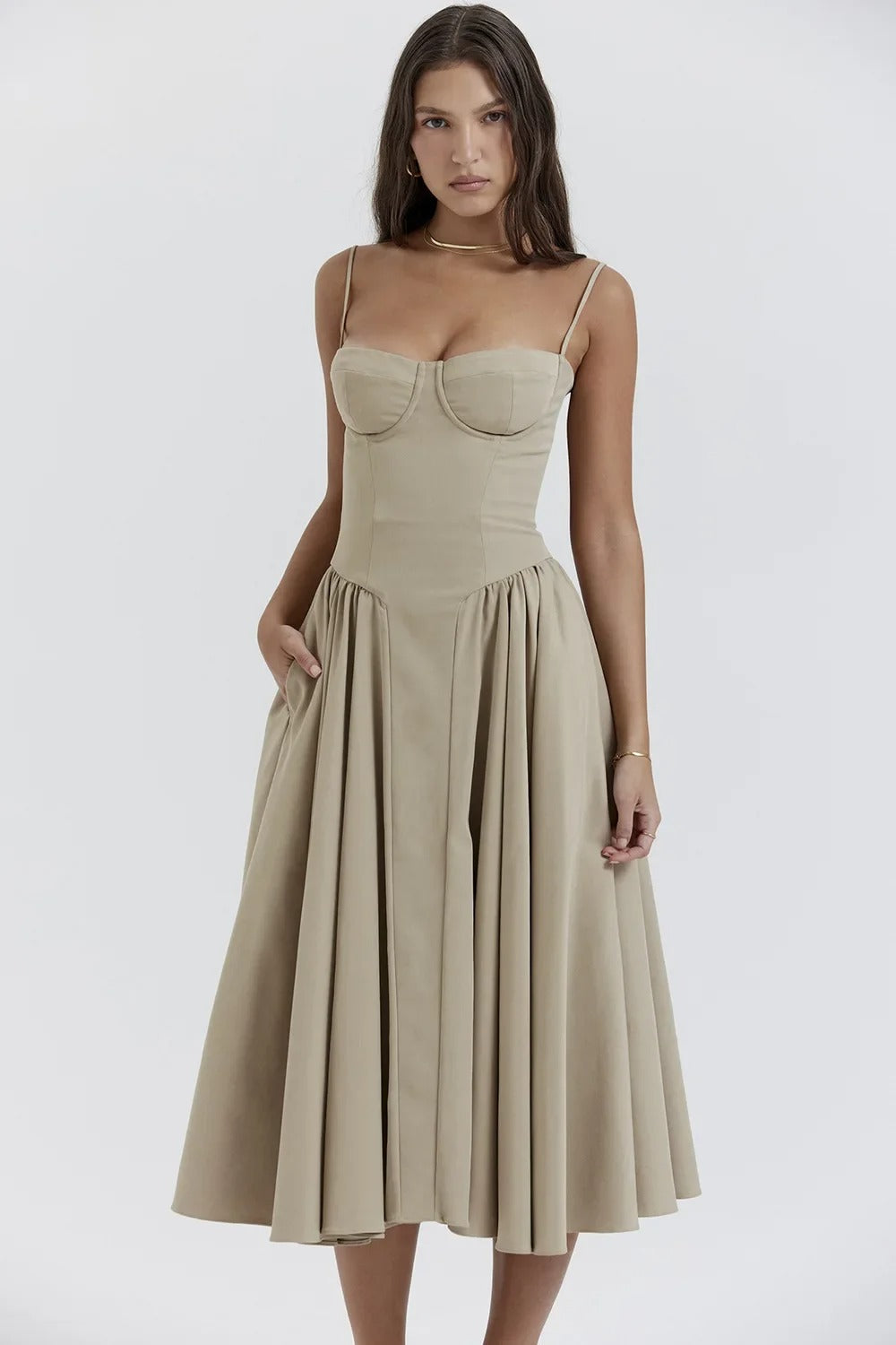 Female model wearing a flowing midi dress