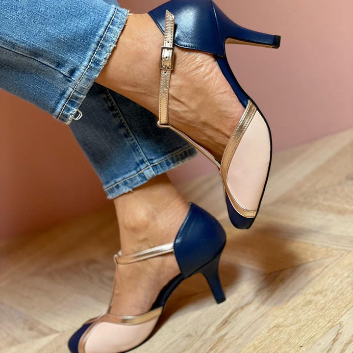 Women’s round toe strap heels with bold colour accents.