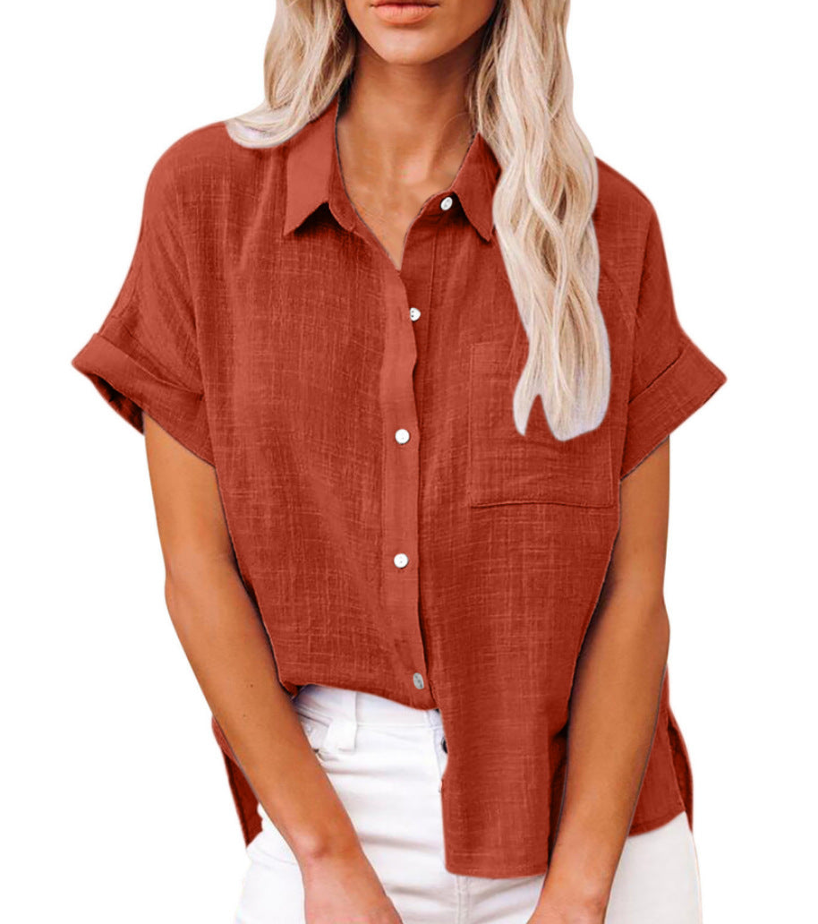  Woman in a relaxed striped blouse with a classic button-front design.