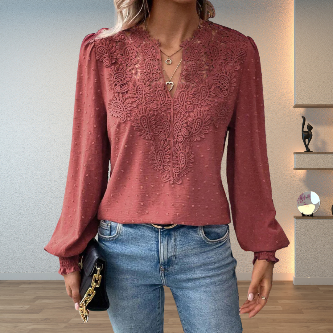  Female wearing a versatile blouse paired with a relaxed and refined look.