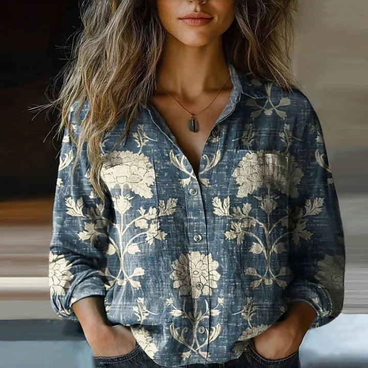  Woman in a relaxed blouse featuring an intricate all-over print.