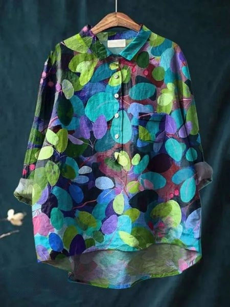 A floral blouse with soft draping and long sleeves.
