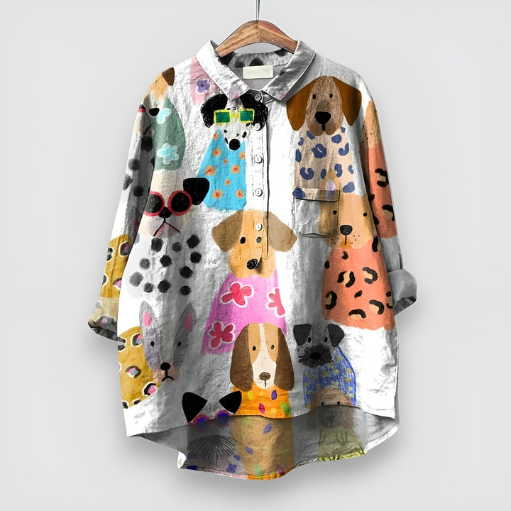 A casual shirt with a playful dog pattern on a plain background.