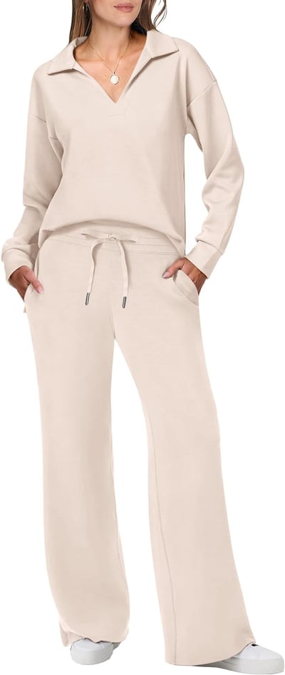 Female modelling a long-sleeved top and leggings co-ord set on a plain background.