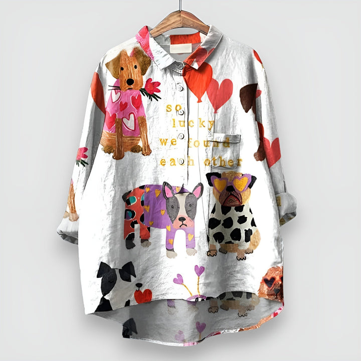  Woman modelling a casual shirt featuring an all-over dog pattern.